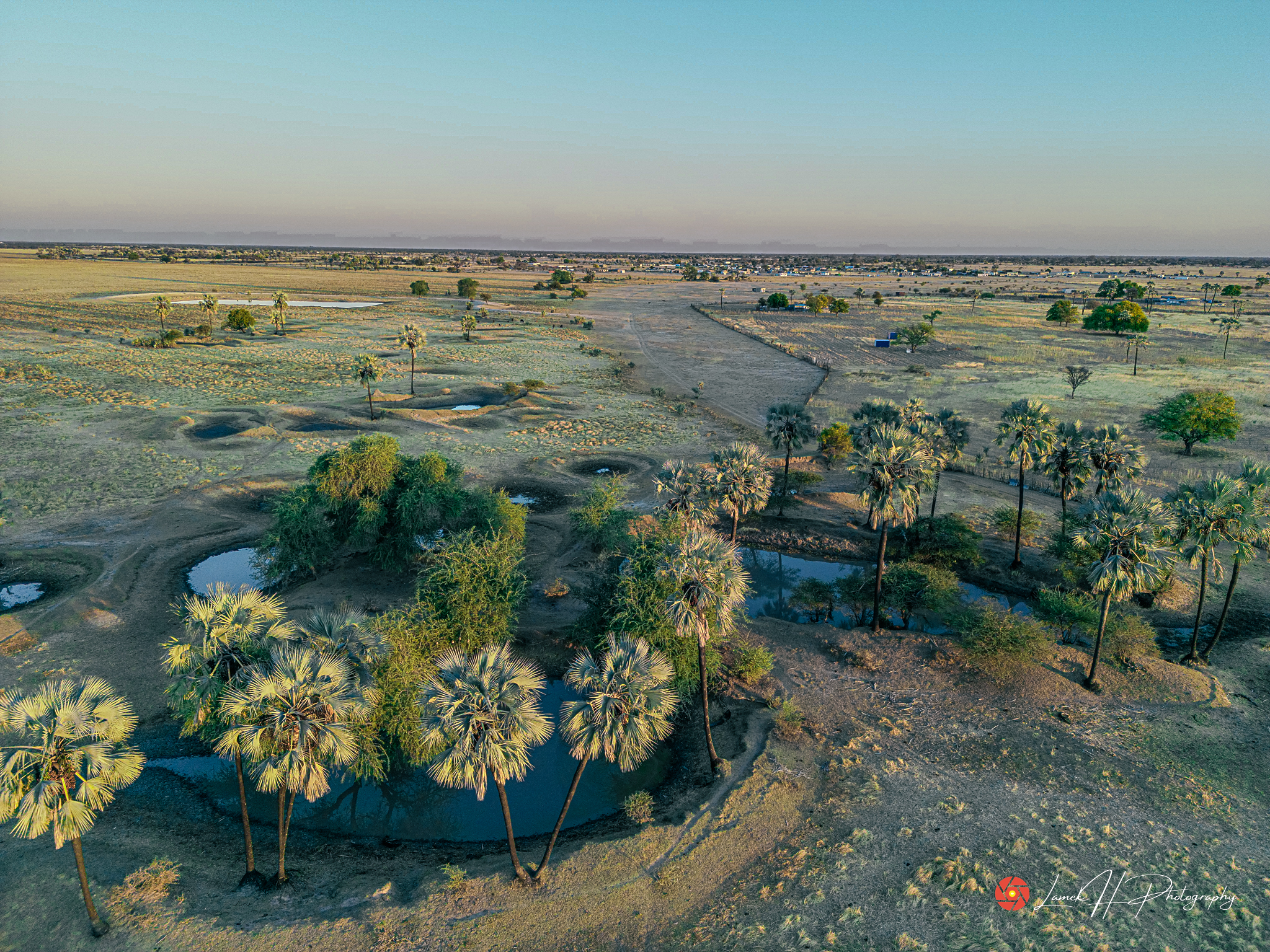 High-angle drone shot of farmland and green fields in Namibia